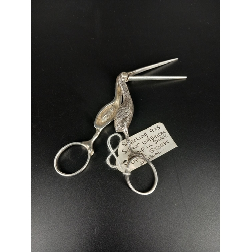 406 - A silver umbilical cord clamp in the shape of a stork - 12cm in length - very unusual item, marked 9... 