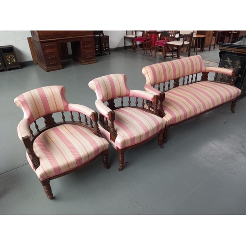 214 - A Victorian upholstered lounge suite consiting of a two seater sofa and two armchairs