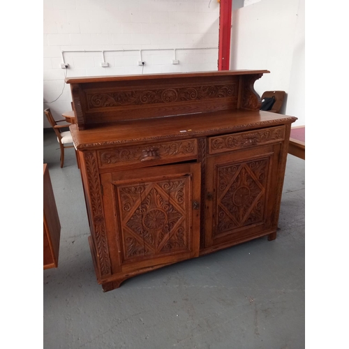 223 - An oak carved buffet/sideboard