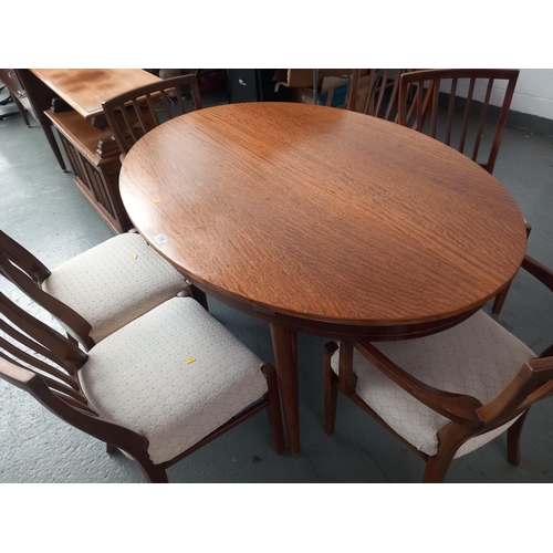 226 - An oval extending dining table and six chairs