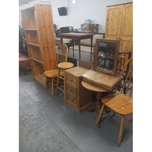 367 - A pine bookcase, pine dressing table mirror, bedside cabinet, two chairs etc