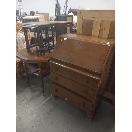 369 - An oak bureau, occasional table and nest of tables