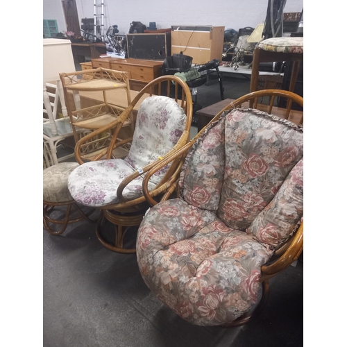 370 - Two bamboo swivel arm chairs together with a bamboo stool and corner shelving unit