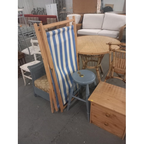 389 - A lloyd loom style wicker chair, two folding deck chairs, painted stool and one other chair