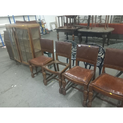 391 - Four oak framed dining chairs along with a china cabinet