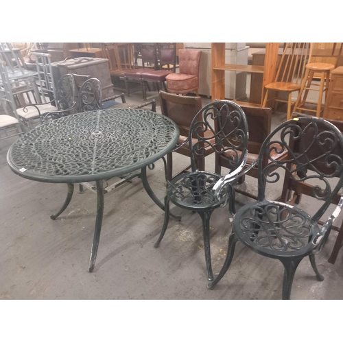 393 - A cast iron garden table and four chairs