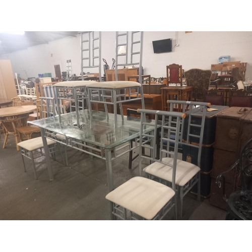 394 - A glass topped dining table with six chairs