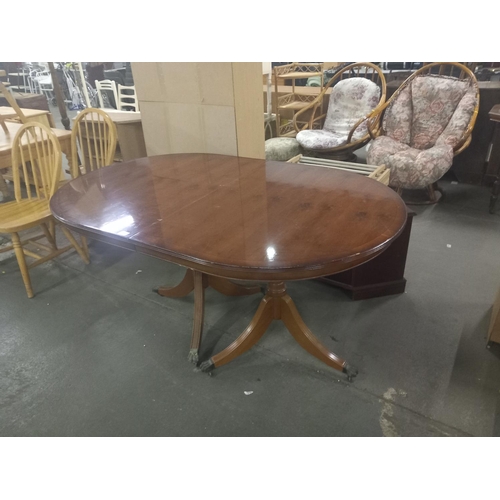 396 - A twin pedestal mahogany dining table