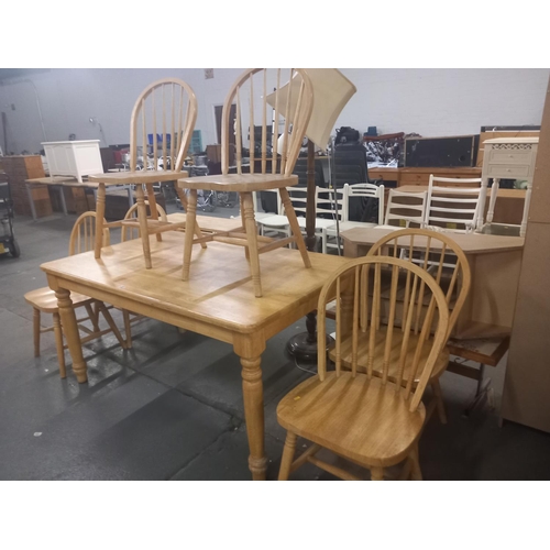 397 - A pine dining table together with six chairs