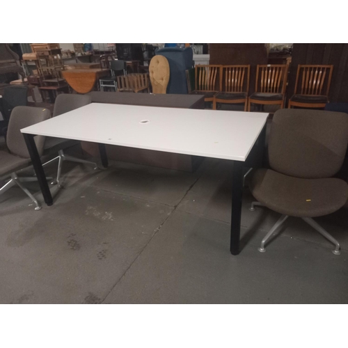 403 - An orangebox office table together with three orangebox swivel chairs