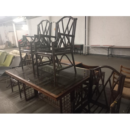 407 - A large smoked glass dining table together with four chairs