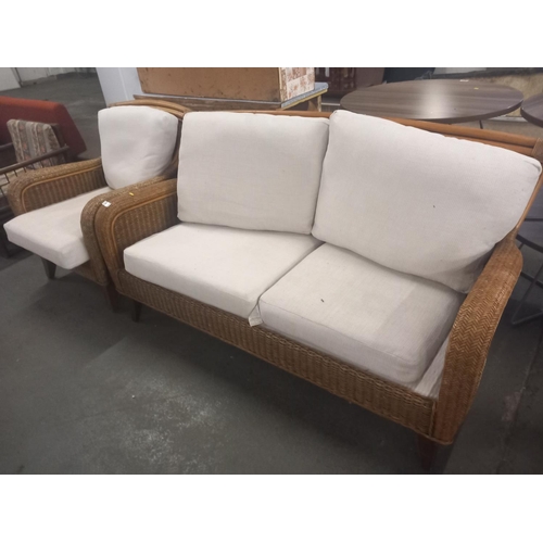 412 - A wicker two seater sofa and matching armchair