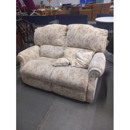 422 - A fabric floral patterned two seater sofa