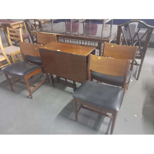 423 - A drop leaf dining table with four chairs