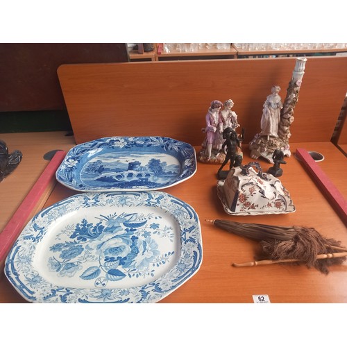 62 - Two blue and white meat platters, two figurines, butter dish, umbrella and two metal figures