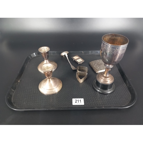 211 - A pair of sterling silver dwarf candlesticks, a hallmarked silver trophy, napkin rins, scottish silv... 