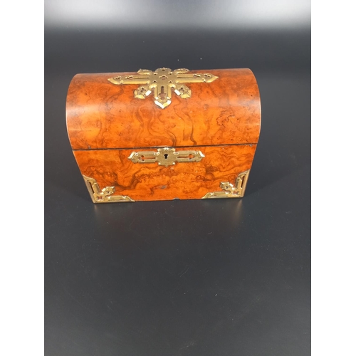 219 - A casket shaped walnut two compartment tea caddy with ormulu mounts