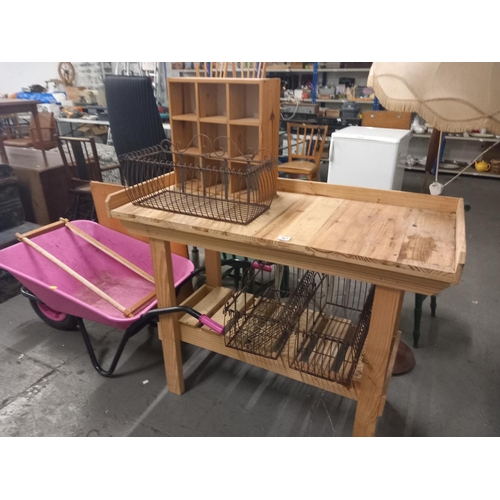 361 - A pine work bench small pine display cabinet, three metal flower baskets, wheelbarrow etc