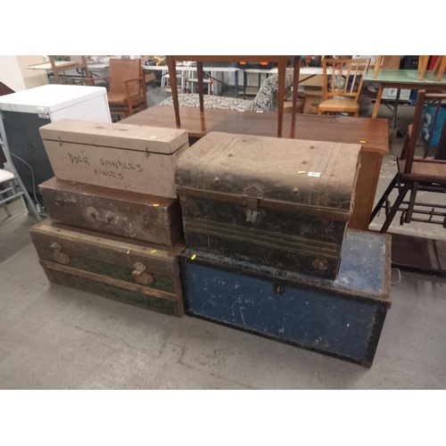 362 - Two wooden bound travelling trunks, two wooden tool boxes and one metal trunk