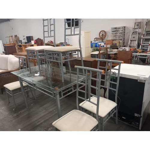 363 - A glass topped dining table with six chairs