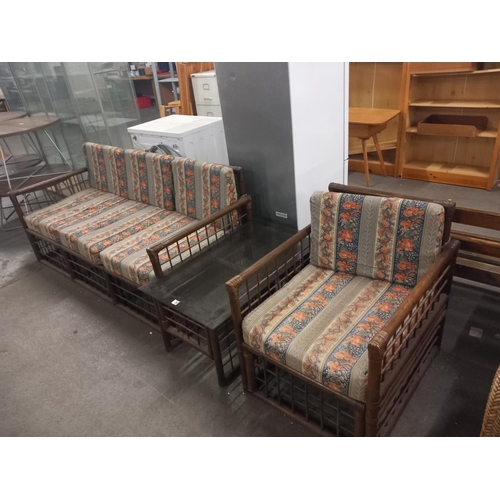 365 - A smoked glass topped coffee table, bamboo armchair along with a bamboo three seater sofa