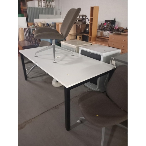 372 - An orangebox office table together with three orangebox swivel chairs