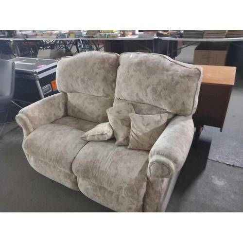 378 - An upholstered two seater sofa