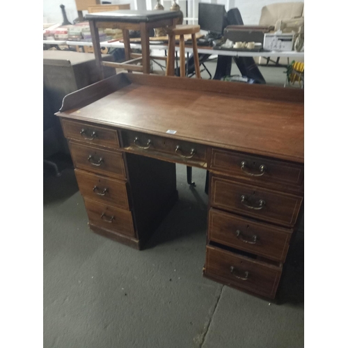 380 - A twin pedestal mahogany inlaid desk