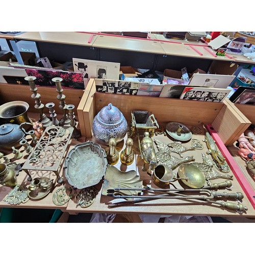 26 - A large quantity of metalware - brass jam pots, brass ornaments, film reels, silver plate, etc