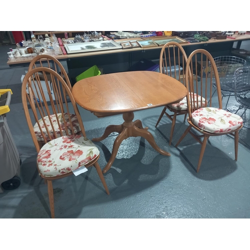 100 - Ercol extending dining table and four chairs