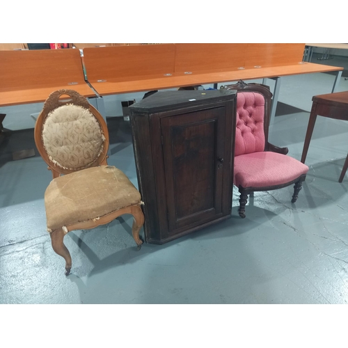 110 - An oak wall hanging corner cabinet together with a nursing chair and one other chair