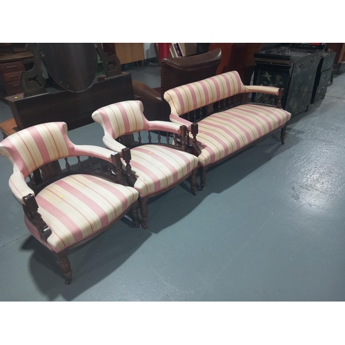 113 - A Victorian upholstered lounge suite consisting of a two seater sofa and two chairs