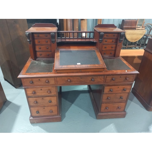 117 - A mahogany leather insert top twin pedestal desk