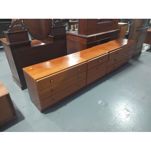 125 - A teak sideboard together with two teak bedside cabinets