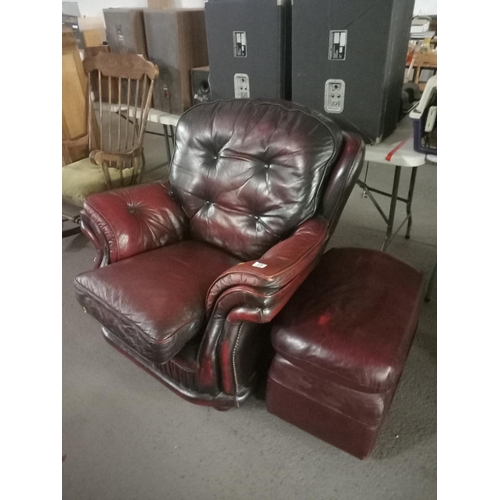 375 - A red leather chestefield style armchair with footstool