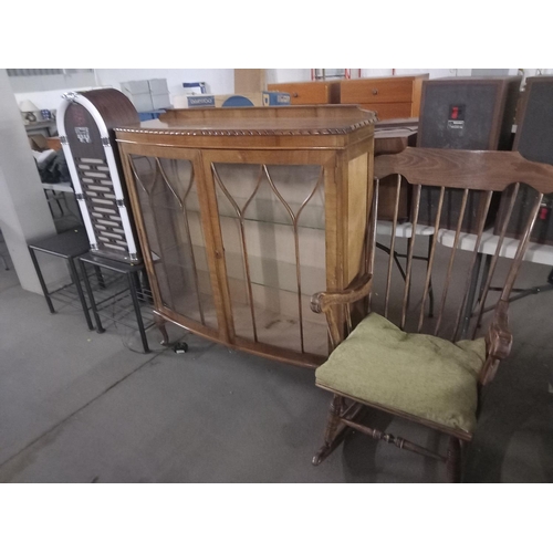 376 - A glass fronted display cabinet, rocking chair, two side tables and an electrical juke box