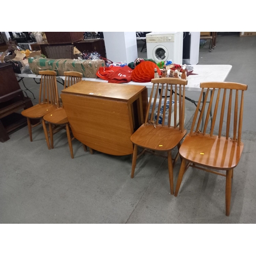 398 - A drop leaf dining table and four chairs