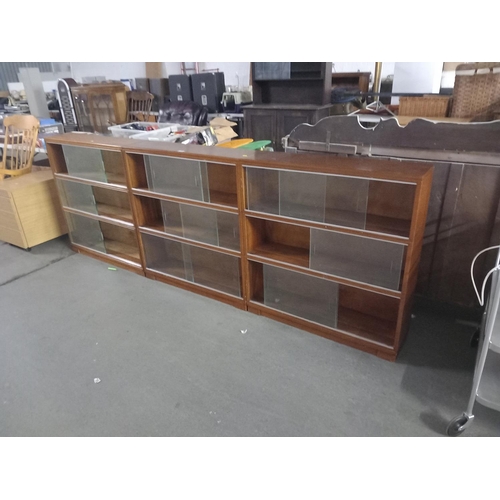 402 - 3X3 sectioned glass fronted bookcases