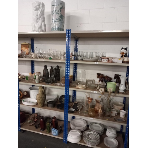 426 - 9 shelves of decorative china and glassware to include part dinner services, ornaments etc