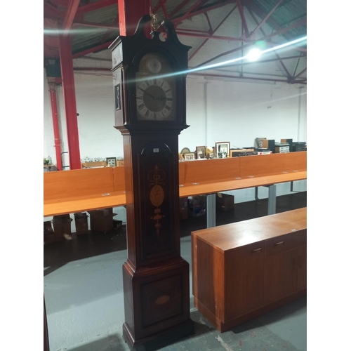 106 - A mahogany inlaid cased grandfather clock with pendulum and keys