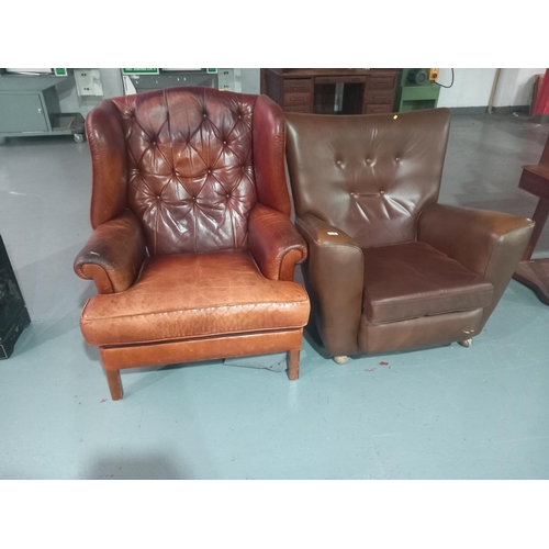 112 - A tan leather armchair together with a mid century style armchair