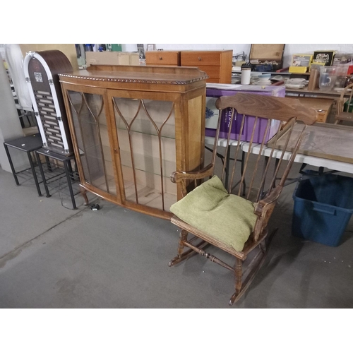 370 - A glass fronted display cabinet, rocking chair, two side tables and an electrical juke box