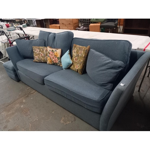 386 - A blue fabric two seater sofa with matching footstool