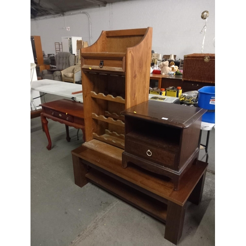 391 - A pine wine rack, stag bedside cabinet, coffee table and hall table