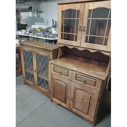 395 - An oak dresser together with a glass fronted bookcase