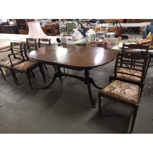 408 - A mahogany dining table and six chairs