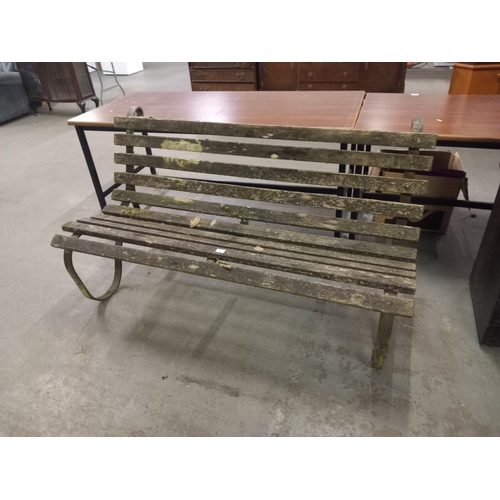 411 - A cast iron base garden bench