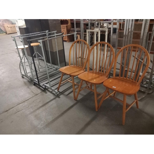 416 - Three spindleback dining chairs together with four clothes rails and two bar stools