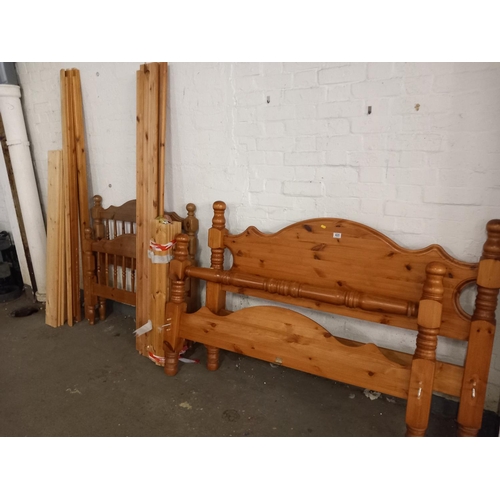 420 - A pine double bed frame along with a pine single bed frame