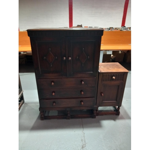 555 - An oak tallboy together with a bedside cabinet